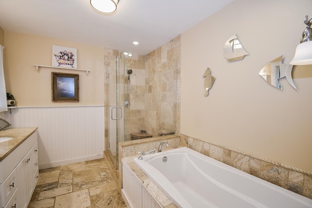 100 Ridgebrook Rd, Torrington, CT 06790 - full bathroom with a bath, a shower stall, vanity, stone tile flooring, and a wainscoted wall