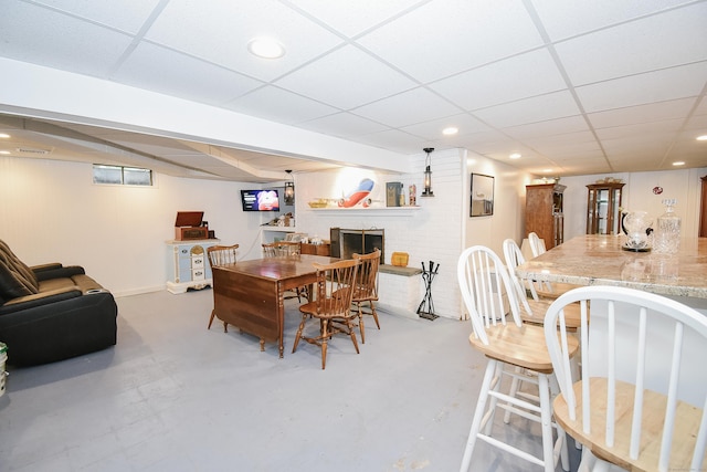 100 Ridgebrook Rd, Torrington, CT 06790 - dining area with a drop ceiling, a brick fireplace, recessed lighting, concrete flooring, and baseboards