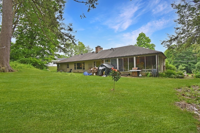 100 Ridgebrook Rd, Torrington, CT 06790 - back of house featuring a sunroom, a chimney, a lawn, and a shingled roof