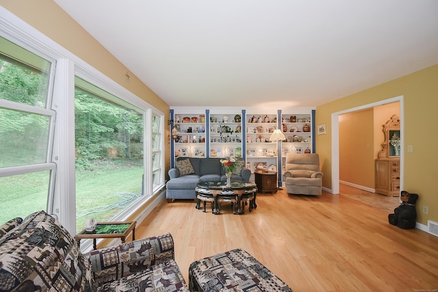 100 Ridgebrook Rd, Torrington, CT 06790 - living area with wood finished floors, plenty of natural light, and baseboards