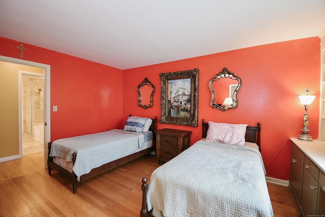 100 Ridgebrook Rd, Torrington, CT 06790 - bedroom with wood finished floors, baseboards, and ensuite bath