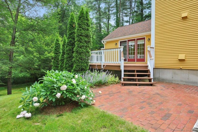 47 Cricket Ln, Somers, CT 06071 - back of house with a deck, a patio area, and roof with shingles
