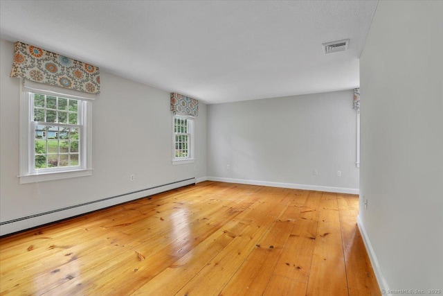 47 Cricket Ln, Somers, CT 06071 - unfurnished room with a baseboard heating unit, plenty of natural light, light wood-style flooring, and baseboards
