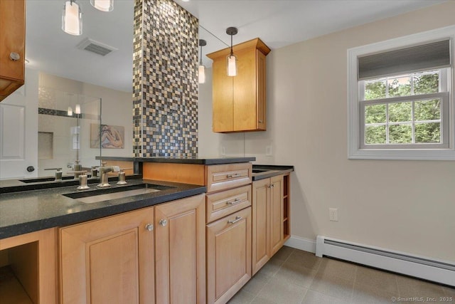 47 Cricket Ln, Somers, CT 06071 - kitchen with baseboard heating, a sink, dark countertops, baseboards, and hanging light fixtures