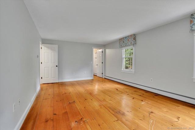 47 Cricket Ln, Somers, CT 06071 - spare room with a baseboard radiator, baseboards, and hardwood / wood-style floors