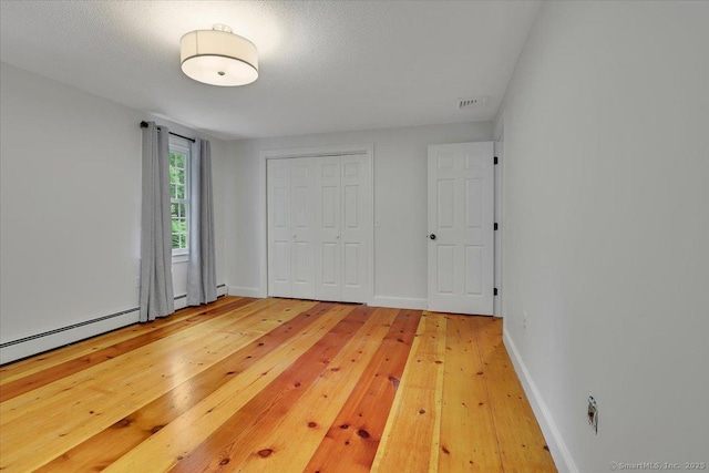 47 Cricket Ln, Somers, CT 06071 - unfurnished bedroom featuring light wood finished floors, a closet, and baseboards
