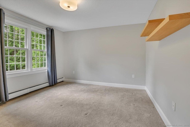 47 Cricket Ln, Somers, CT 06071 - spare room with carpet floors, baseboards, and a baseboard radiator