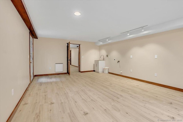 47 Cricket Ln, Somers, CT 06071 - below grade area with light wood finished floors, track lighting, and baseboards