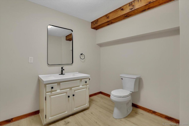 47 Cricket Ln, Somers, CT 06071 - half bath featuring wood finished floors, vanity, toilet, and baseboards