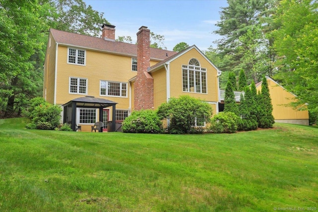 47 Cricket Ln, Somers, CT 06071 - rear view of property featuring a gazebo, a chimney, and a lawn