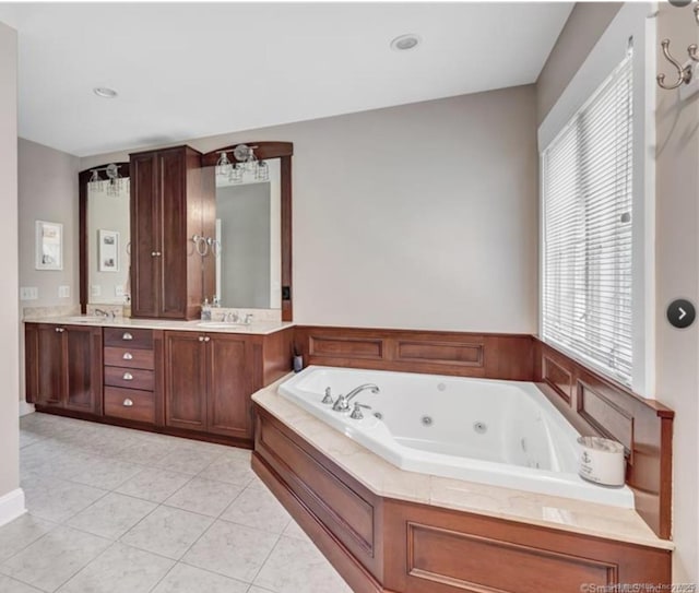 57 Church St, Shelton, CT 06484 - bathroom with double vanity, a jetted tub, and tile patterned floors