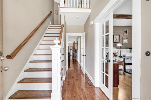 57 Church St, Shelton, CT 06484 - staircase featuring french doors and wood finished floors