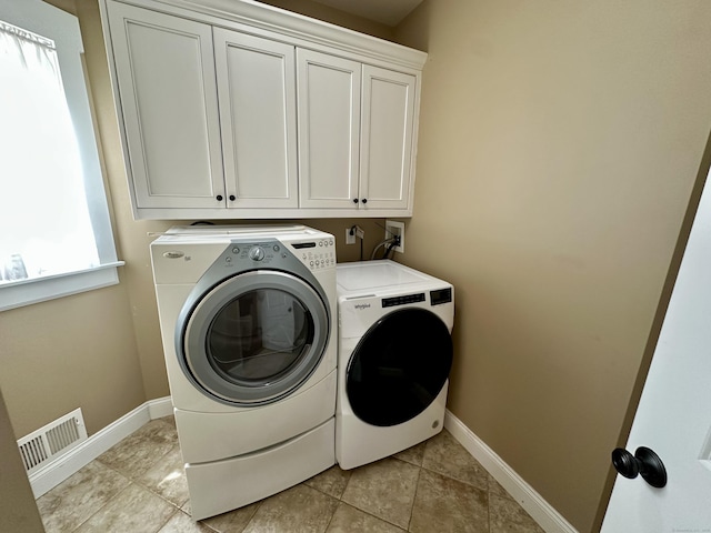 57 Church St, Shelton, CT 06484 - washroom featuring cabinet space, washer and dryer, and light tile patterned floors