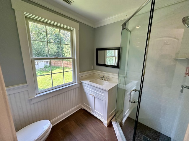 57 Church St, Shelton, CT 06484 - full bath featuring wood finished floors, a wainscoted wall, a shower stall, vanity, and ornamental molding