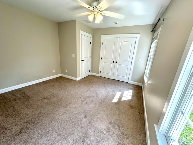 57 Church St, Shelton, CT 06484 - unfurnished bedroom with carpet floors, a closet, and a ceiling fan