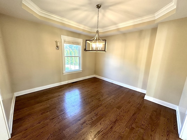 57 Church St, Shelton, CT 06484 - empty room featuring ornamental molding, a tray ceiling, a chandelier, and dark wood-style floors