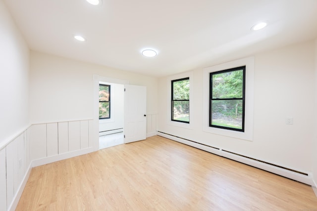 219 Redding Rd, Redding, CT 06896 - empty room with a baseboard radiator, wood finished floors, and recessed lighting