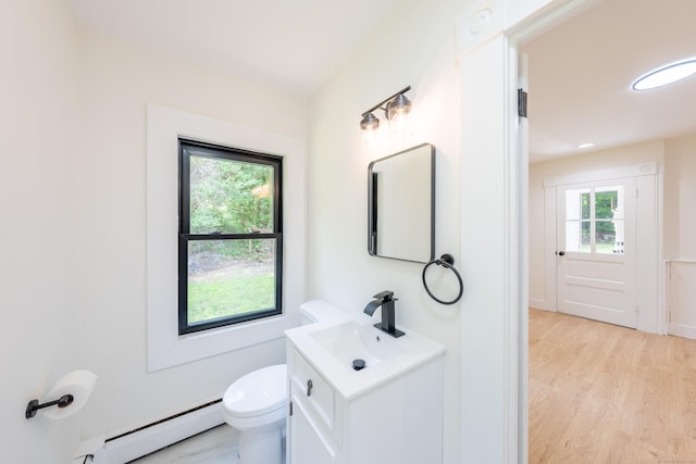 219 Redding Rd, Redding, CT 06896 - half bathroom featuring baseboard heating, vanity, and wood finished floors