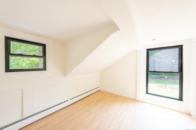219 Redding Rd, Redding, CT 06896 - additional living space featuring baseboard heating, light wood-style flooring, and vaulted ceiling