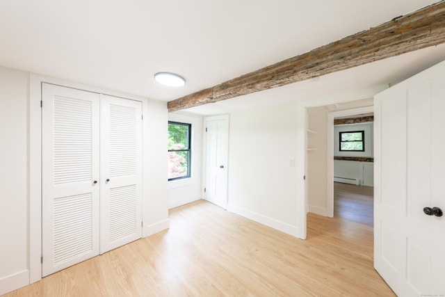 219 Redding Rd, Redding, CT 06896 - unfurnished bedroom featuring light wood-style flooring, baseboard heating, and a closet