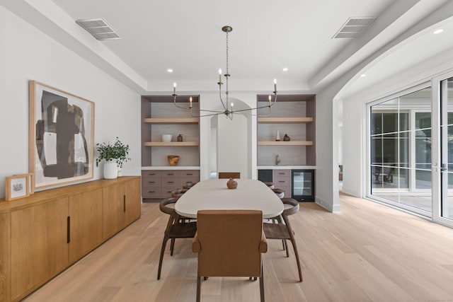 86 Old Rd, Westport, CT 06880 - dining room with beverage cooler, light wood-type flooring, a chandelier, built in features, and recessed lighting
