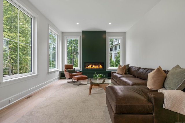 86 Old Rd, Westport, CT 06880 - living area featuring wood finished floors, a large fireplace, and recessed lighting