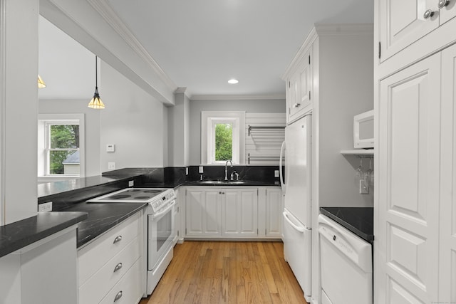 75 Harrison Ave, Wallingford, CT 06492 - kitchen featuring white appliances, white cabinets, light wood-type flooring, dark countertops, and recessed lighting