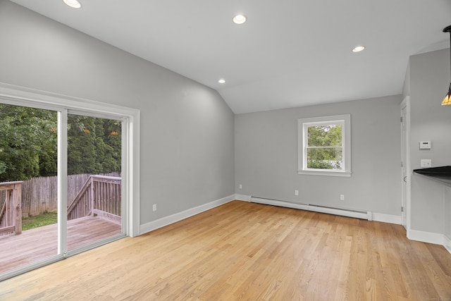 75 Harrison Ave, Wallingford, CT 06492 - unfurnished living room featuring baseboard heating, vaulted ceiling, wood finished floors, and recessed lighting
