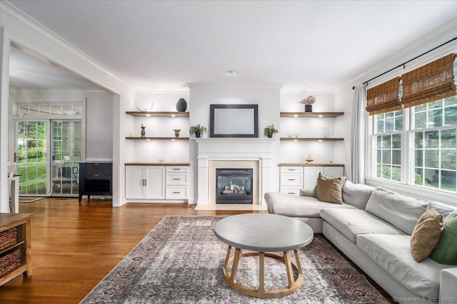 22 Woods Way Unit 22, Redding, CT 06896 - living area with a fireplace with flush hearth, wood finished floors, and ornamental molding