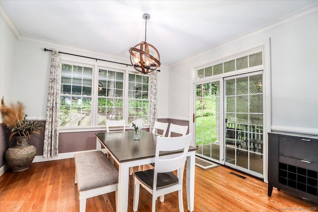 22 Woods Way Unit 22, Redding, CT 06896 - dining space featuring crown molding, a chandelier, and wood finished floors