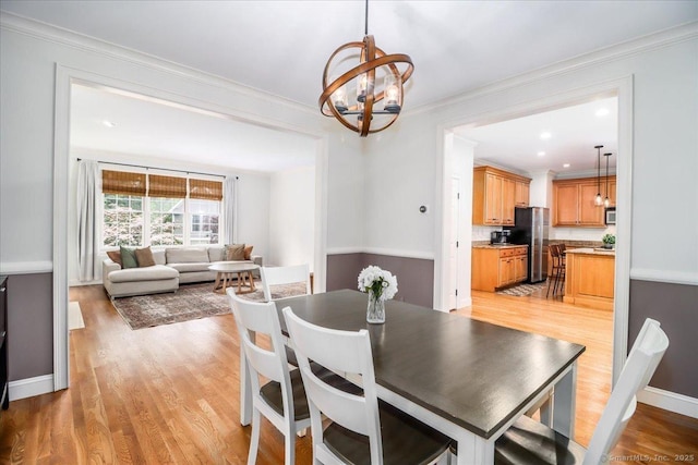 22 Woods Way Unit 22, Redding, CT 06896 - dining space with a chandelier, crown molding, light wood-style flooring, and recessed lighting