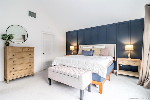 22 Woods Way Unit 22, Redding, CT 06896 - bedroom featuring light carpet, high vaulted ceiling, and a decorative wall