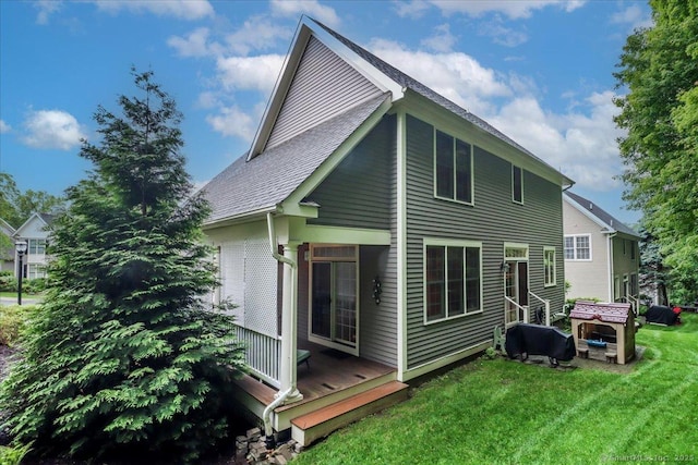 22 Woods Way Unit 22, Redding, CT 06896 - rear view of house with a lawn, a wooden deck, and roof with shingles
