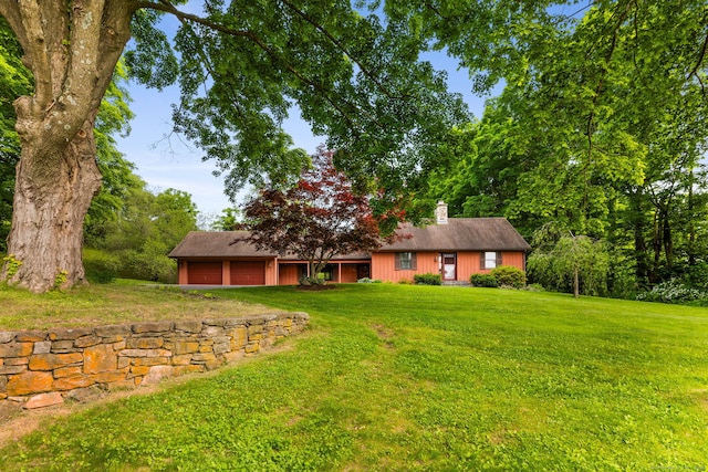 389 Chamberlain Rd, Middletown, CT 06457 - view of front of home with a front yard, a chimney, and an attached garage