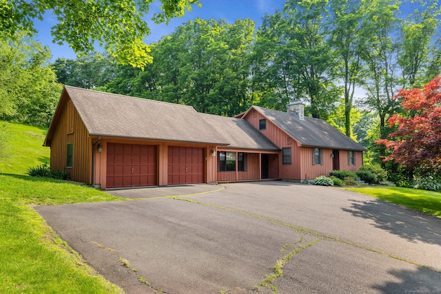 389 Chamberlain Rd, Middletown, CT 06457 - rustic home with a front yard, a garage, roof with shingles, a chimney, and driveway