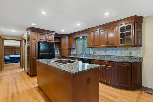 389 Chamberlain Rd, Middletown, CT 06457 - kitchen featuring black appliances, light wood-style flooring, open shelves, tasteful backsplash, and recessed lighting