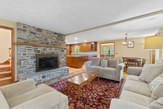 389 Chamberlain Rd, Middletown, CT 06457 - living area featuring a chandelier, a fireplace, light wood-style floors, and recessed lighting