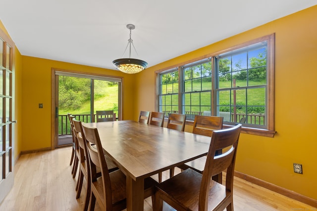 389 Chamberlain Rd, Middletown, CT 06457 - dining space with light wood finished floors and a chandelier