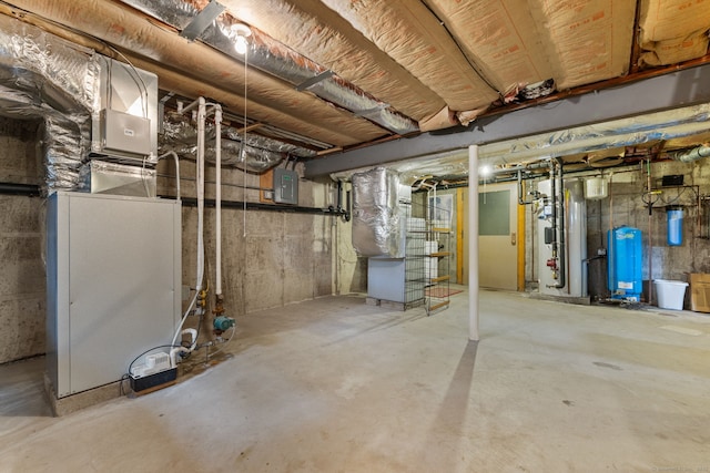 389 Chamberlain Rd, Middletown, CT 06457 - unfinished below grade area with a water pressure tank and electric panel