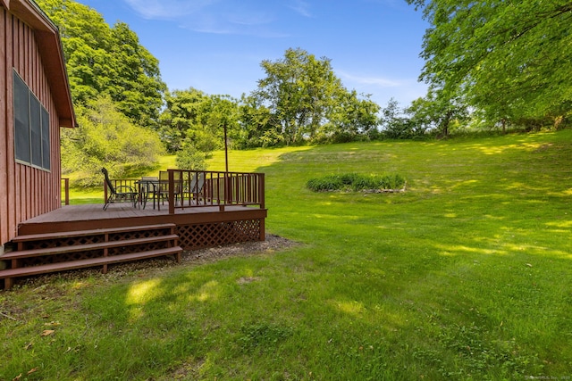 389 Chamberlain Rd, Middletown, CT 06457 - view of grassy yard with a wooden deck and view of scattered trees