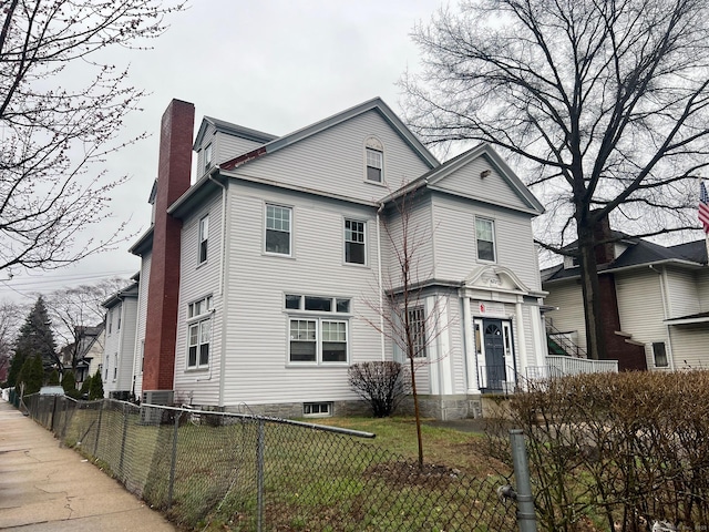 670 Clinton Ave, Bridgeport, CT 06605 - traditional-style home featuring a chimney and central AC unit