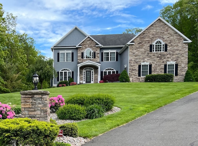 110 Laurelwood Dr, Southington, CT 06479 - view of front of property featuring stone siding and a front yard