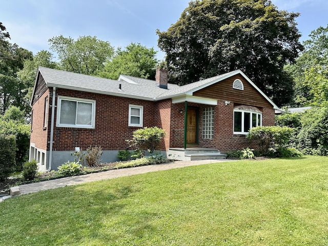846 Sawmill Rd, West Haven, CT 06516 - ranch-style house with brick siding, a chimney, a front yard, and a shingled roof