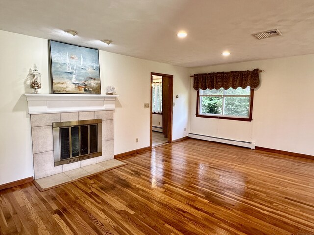 846 Sawmill Rd, West Haven, CT 06516 - unfurnished living room with a baseboard radiator, wood finished floors, a fireplace, and recessed lighting
