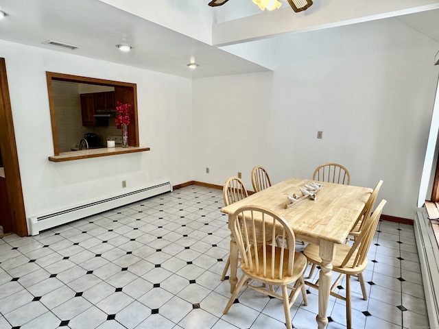 846 Sawmill Rd, West Haven, CT 06516 - dining room with baseboard heating, ceiling fan, and light floors