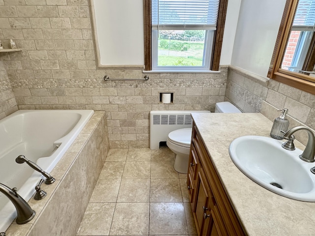 846 Sawmill Rd, West Haven, CT 06516 - bathroom with radiator heating unit, healthy amount of natural light, a relaxing tiled tub, tile walls, and vanity