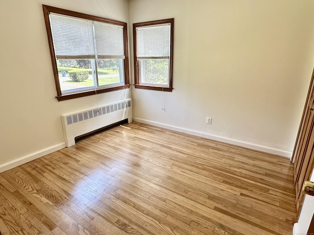 846 Sawmill Rd, West Haven, CT 06516 - unfurnished room with radiator and light wood finished floors