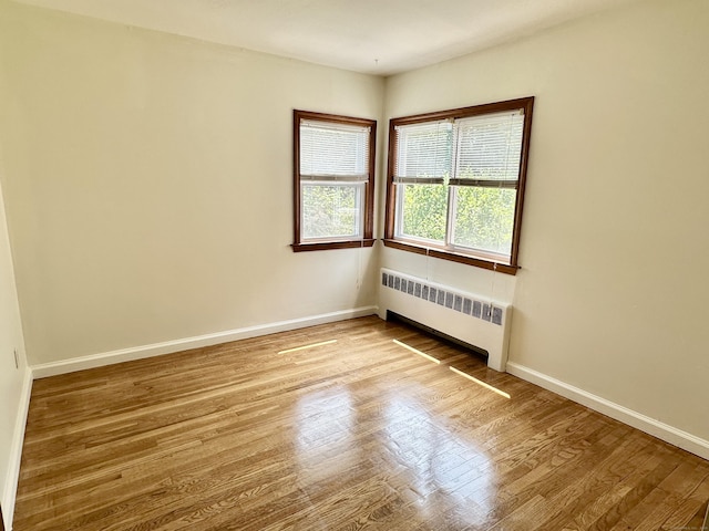 846 Sawmill Rd, West Haven, CT 06516 - spare room with radiator and wood finished floors