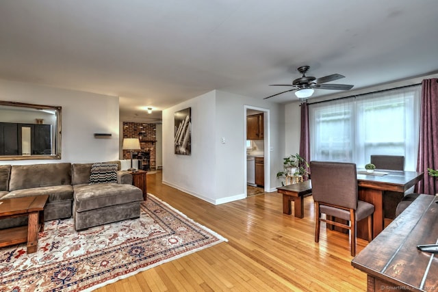 17 Brush Hill Rd, Clinton, CT 06413 - living area featuring ceiling fan, light wood finished floors, and a fireplace