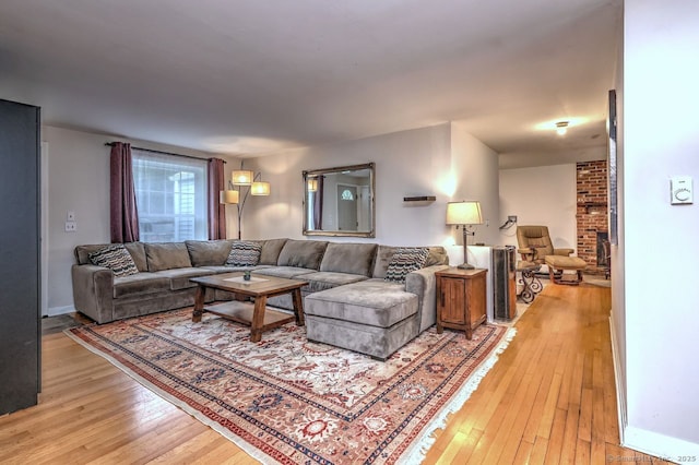 17 Brush Hill Rd, Clinton, CT 06413 - living room with light wood-style flooring and a fireplace